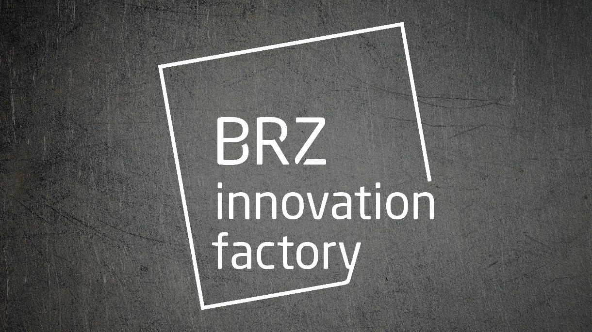 a metaltextured background with white BRZ Innovation Factory Logo