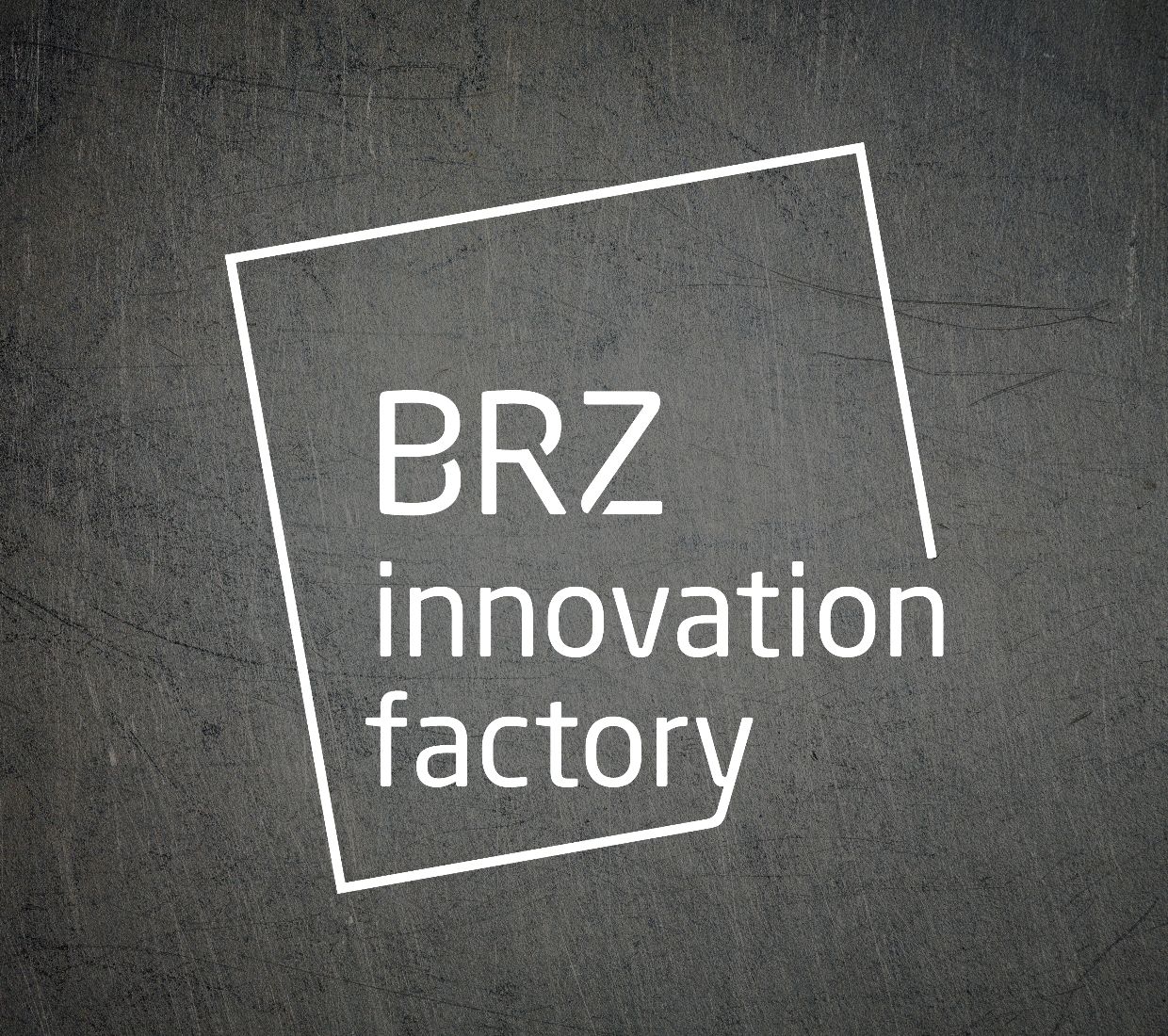 a metaltextured background with white BRZ Innovation Factory Logo