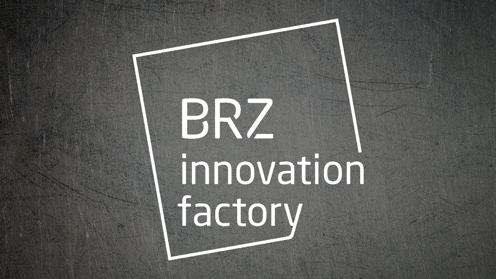 Logo der BRZ Innovation Factory in weiß auf einem Metalltextur Hintergrund.