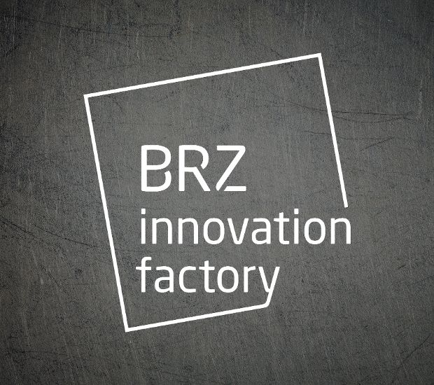 a metaltextured background with white BRZ Innovation Factory Logo